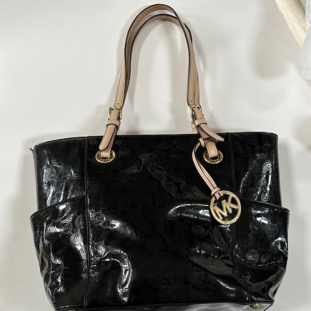 Michael by Michael Kors jet set  bag with two side pouches,3 in the center.